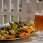 Seafood with beer on a white table