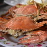 Cooked crabs on a vintage plate